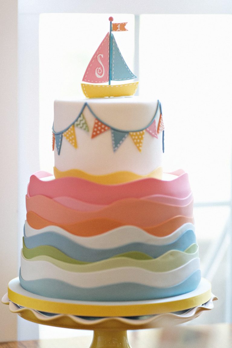 first birthday Row Row Row Your Boat pastel rainbow nautical cake kids party planner